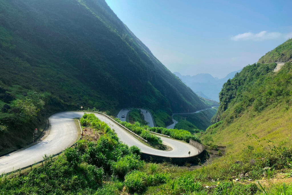 A car driving the S-curves of Tham Ma Pass near Dong Van, Ha Giang, Vietnam