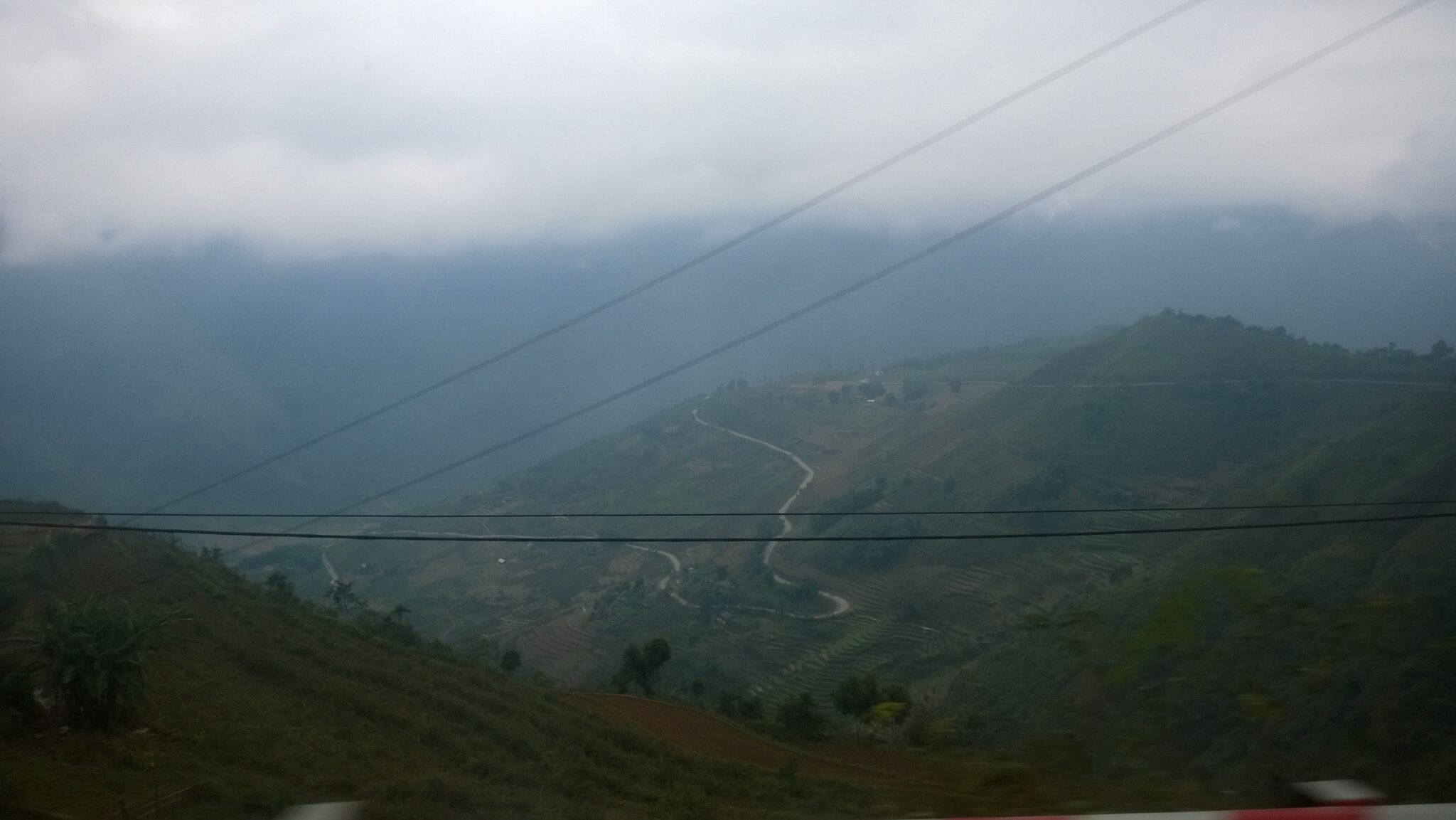 Fog over misty Ha Giang mountains, a common visibility hazard on the Ha Giang Loop